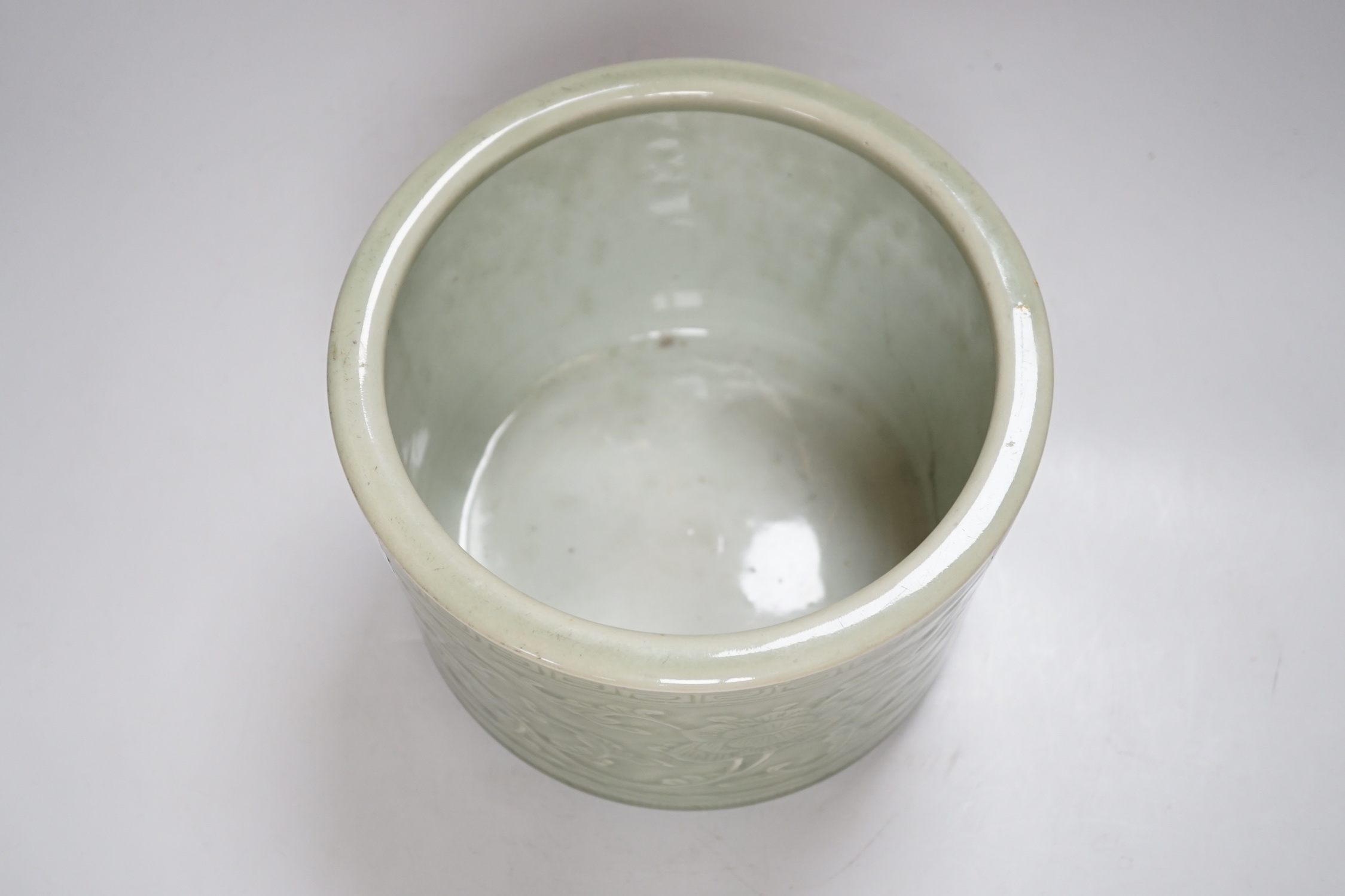 A Chinese celadon glazed tripod brushpot, 19th century